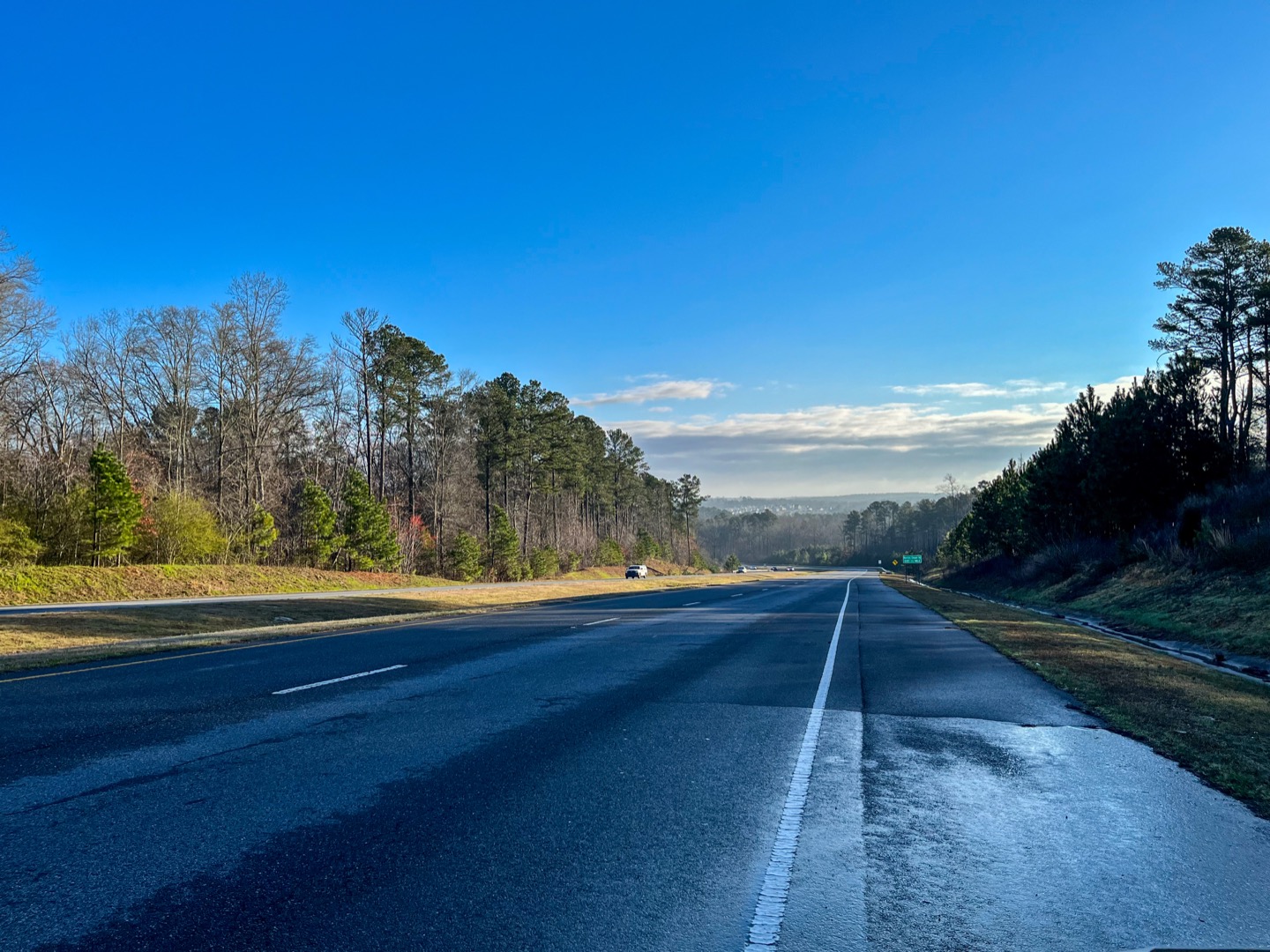Sugarloaf Parkway near Lawrenceville, with trees lining the road